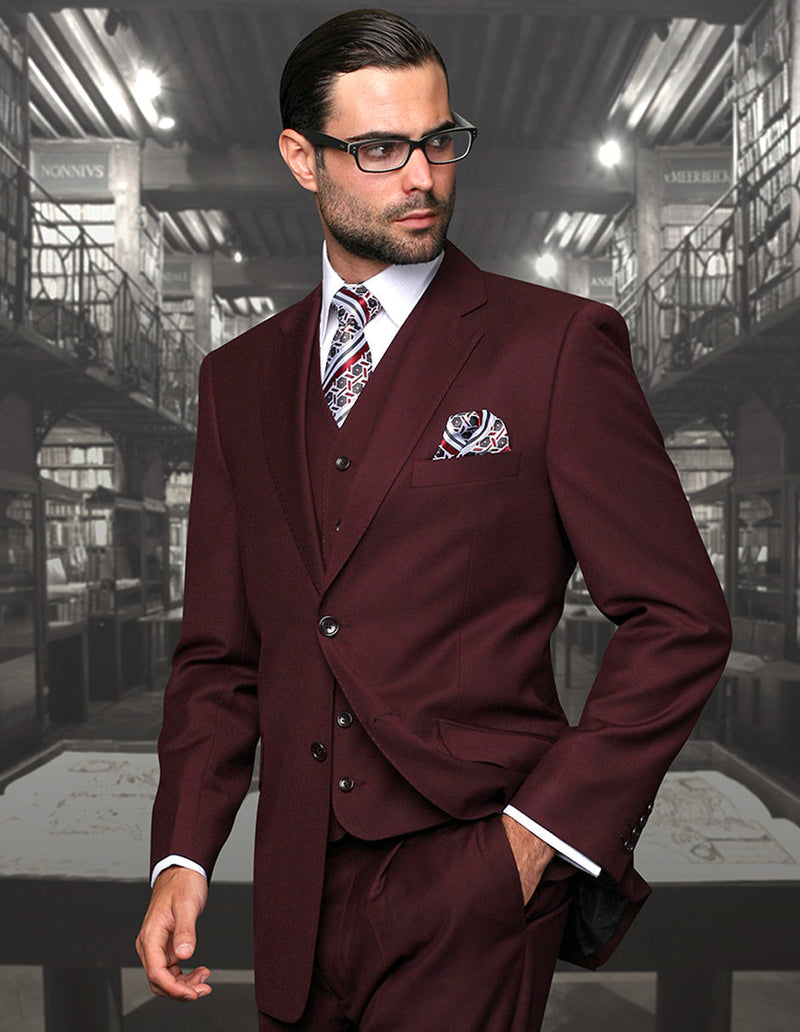 Men's classic fit, pleated, 2-button burgundy suit in Big & Tall sizes. Includes matching vest. Tailored silhouette, subtle stitching, and visible pockets. Suitable for formal wear.