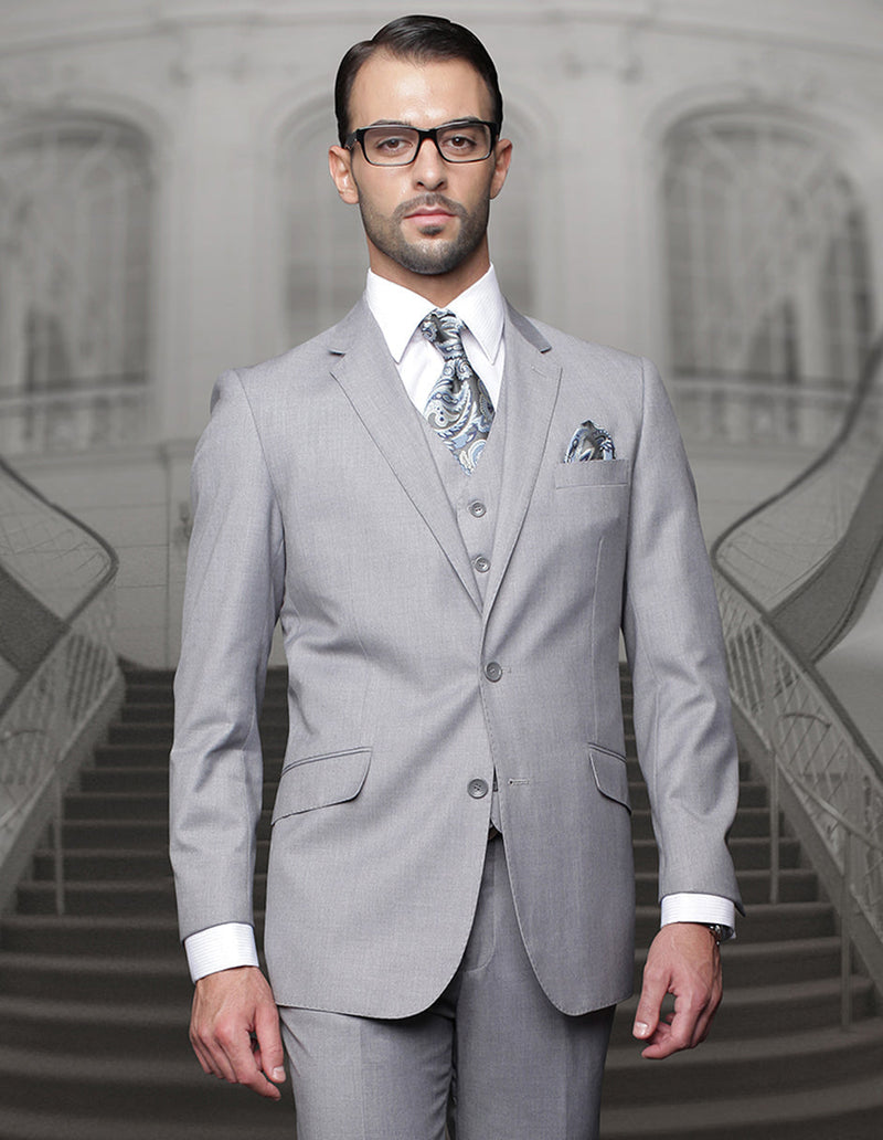 Men's big & tall grey suit. Classic fit, 2-button closure, pleated pants, structured shoulders, notch lapel. Features side pockets. Light grey fabric.