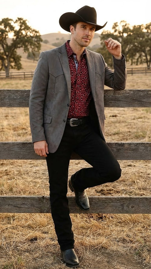 Men’s brown western faux suede blazer by Alberto Nardoni features a tailored fit with a notch lapel, front pockets, and a smooth texture. The color is a rich brown, complemented by subtle stitching details.