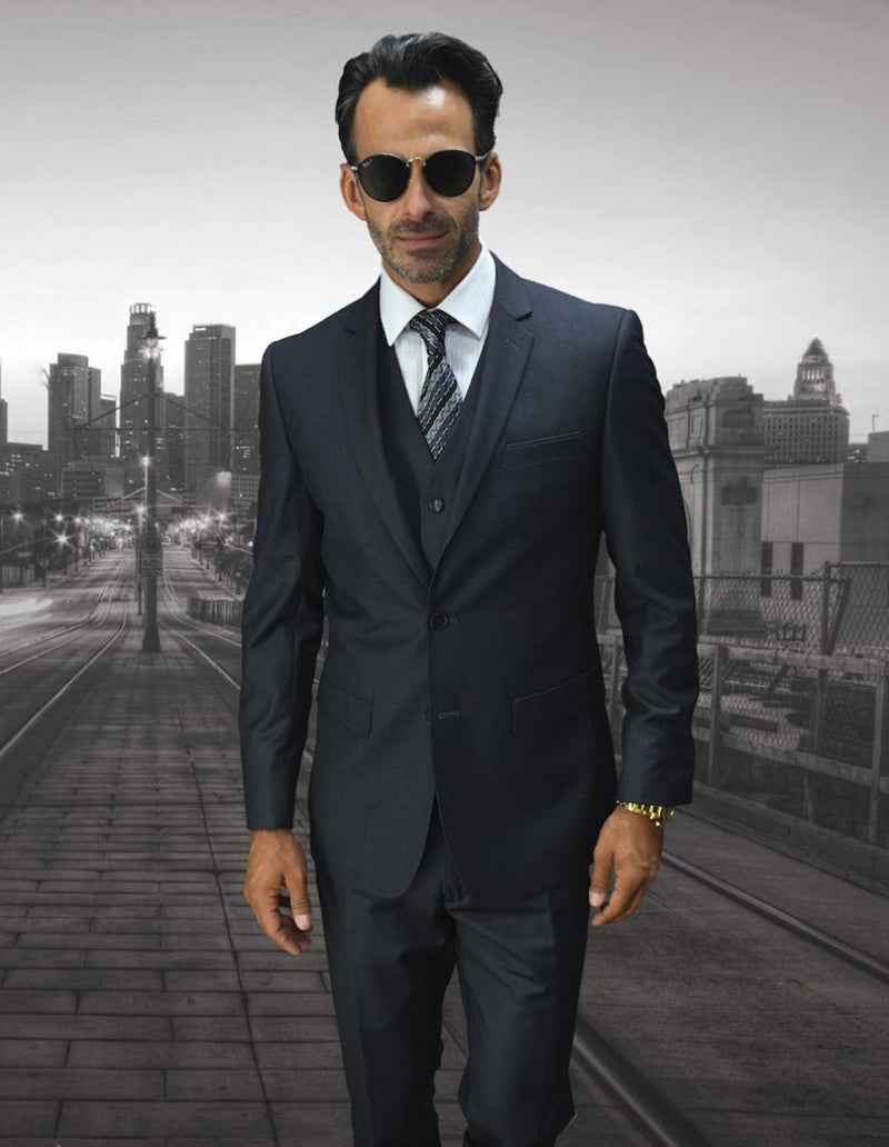 Men's charcoal grey wool suit: skinny fit, 2-button blazer, vest, and trousers. Tailored with a structured silhouette. Modern slim fit for a cohesive, stylish appearance.