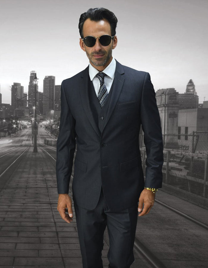 Men's charcoal grey wool suit: skinny fit, 2-button blazer, vest, and trousers. Tailored with a structured silhouette. Modern slim fit for a cohesive, stylish appearance.