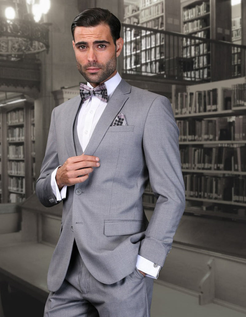 Men's Grey Wool Suit. Skinny fit, 2-button closure. Includes vest and matching trousers with side pockets. Slim silhouette, crafted from wool. Classic and sleek design.