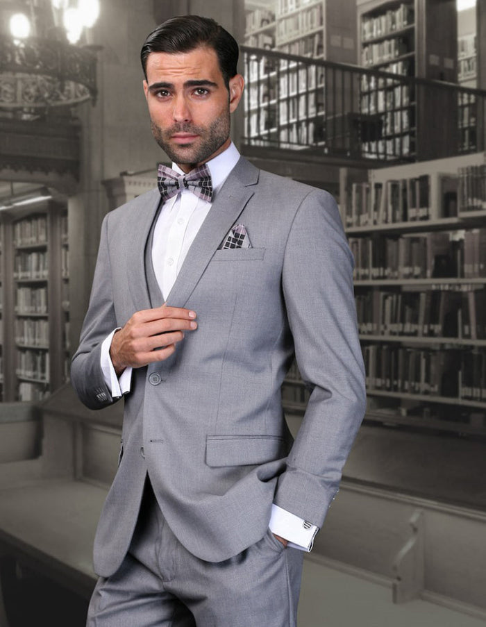 Men's Grey Wool Suit. Skinny fit, 2-button closure. Includes vest and matching trousers with side pockets. Slim silhouette, crafted from wool. Classic and sleek design.