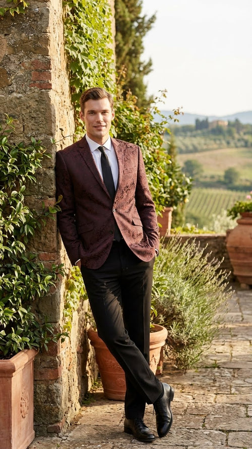 Men's burgundy velvet blazer with paisley pattern, slim fit. Notched lapel, two front pockets, and single-button closure.
