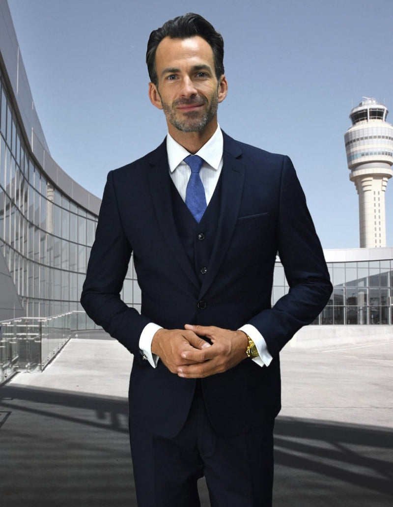 Navy blue men's 2-button skinny vested wool suit. Tailored fit with vest. Smooth finish on the jacket.