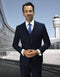 Navy blue men's 2-button skinny vested wool suit. Tailored fit with vest. Smooth finish on the jacket.
