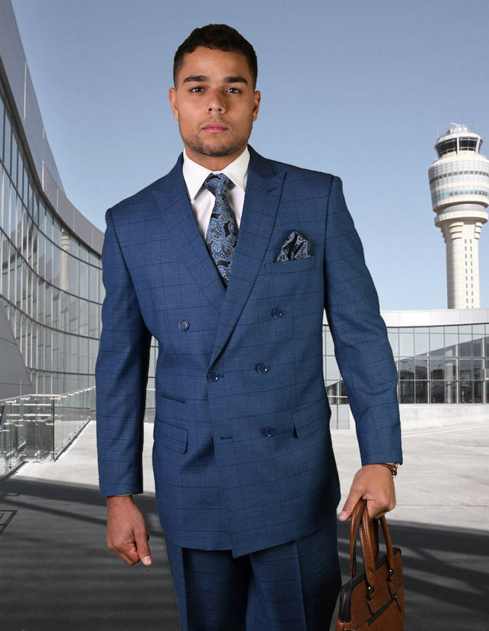 Men's indigo windowpane wool double-breasted suit. Tailored fit, notch lapels, side pockets. Jacket with matching trousers. Structured shape.
