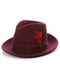 Burgundy gangster hat with rounded crown & wide brim. Features a feather & bow accent. Classic style, perfect for adding a touch of vintage flair.
