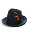 1920s gangster hat: Dark navy, soft structure, tapered crown, wide brim. Features a red feather and black ribbon band. Classic men's style.
