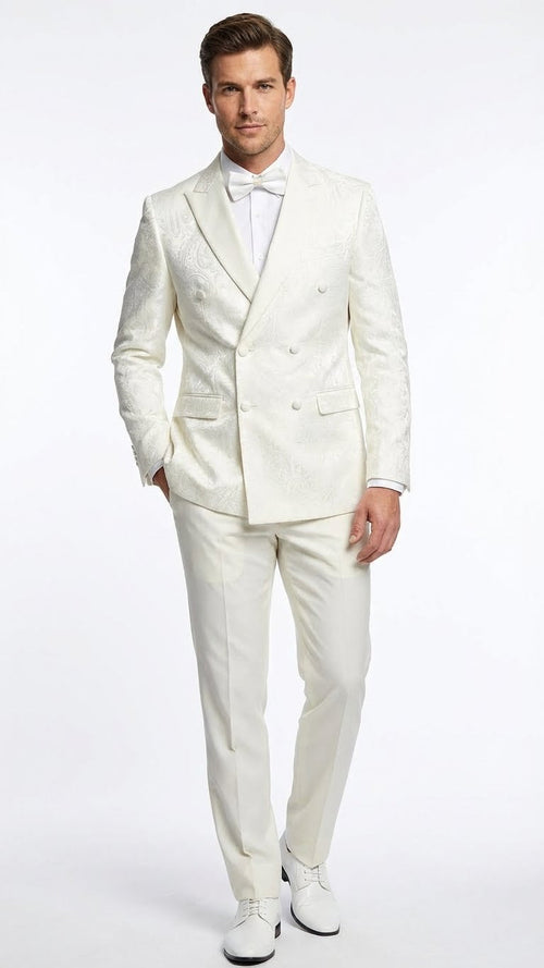 Ivory double-breasted tuxedo jacket with shawl collar, subtle embossed pattern. Includes matching trousers. Features two pockets. Styled with white shirt and bow tie.

