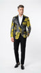 Alberto Nardoni men's yellow tuxedo with black and gold floral blazer. Structured fit, notched lapel, two front pockets, contrasting black interior. Bold floral pattern on black, worn with white shirt and black trousers.
