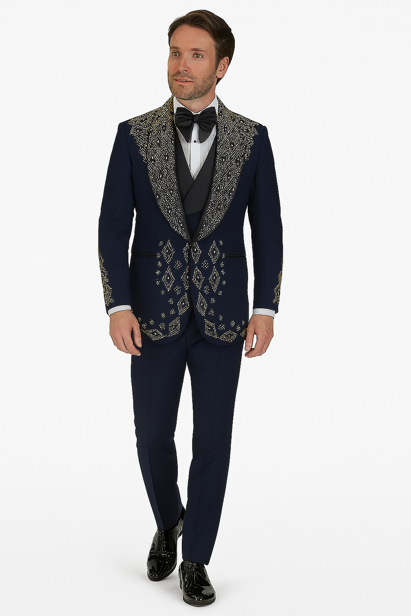 Navy men's tuxedo with tailored fit, single-button, peaked lapels, and gold geometric embroidery. Includes navy pants. Formal wear suitable fabric. Paired with white shirt and black bow tie.
