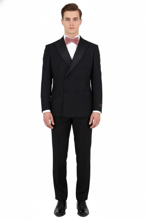 Classic black double-breasted tuxedo. 100% Super 150s Italian wool. Structured silhouette, sharp lapels, matching trousers. Formal with white shirt and bow tie. Solid black. Elegant.