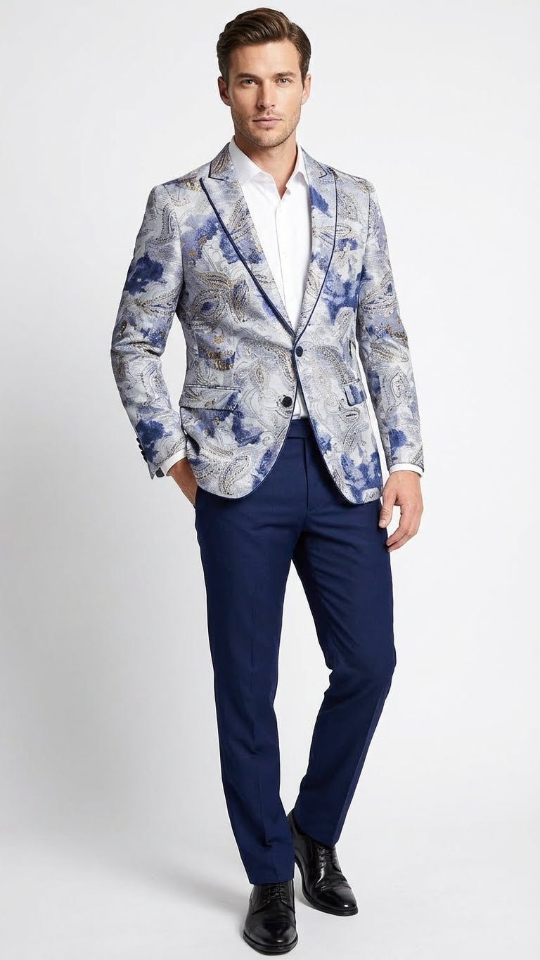 Navy blue & gray paisley blazer with a fitted shape, single button closure, notched lapel, and two front pockets. Intricate paisley pattern. Paired with navy trousers. Classic design.
