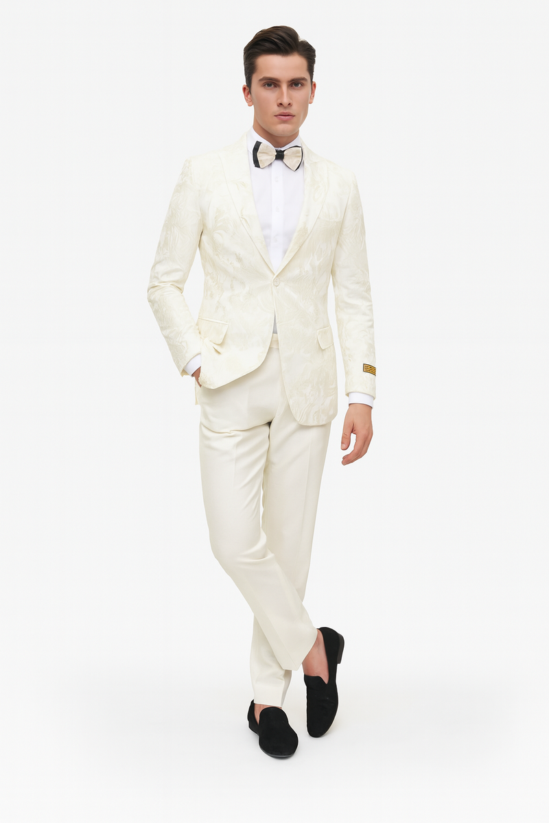 Ivory tuxedo jacket with subtle floral embroidery, cream-colored, paired with matching ivory pants. Tailored fit for a streamlined, elegant look.
