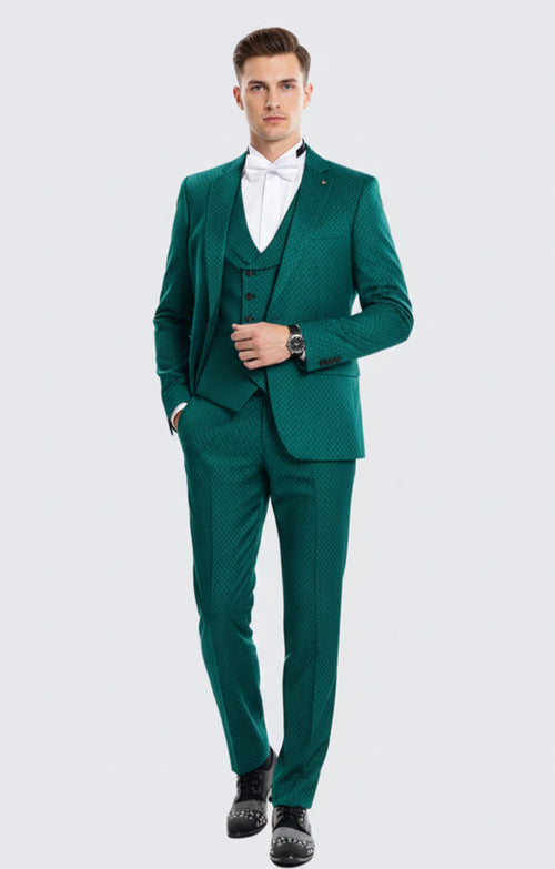 Emerald green men's 3-piece suit. Features fitted jacket, patterned vest, and tailored trousers. Subtle textured fabric creates a sophisticated, cohesive look.