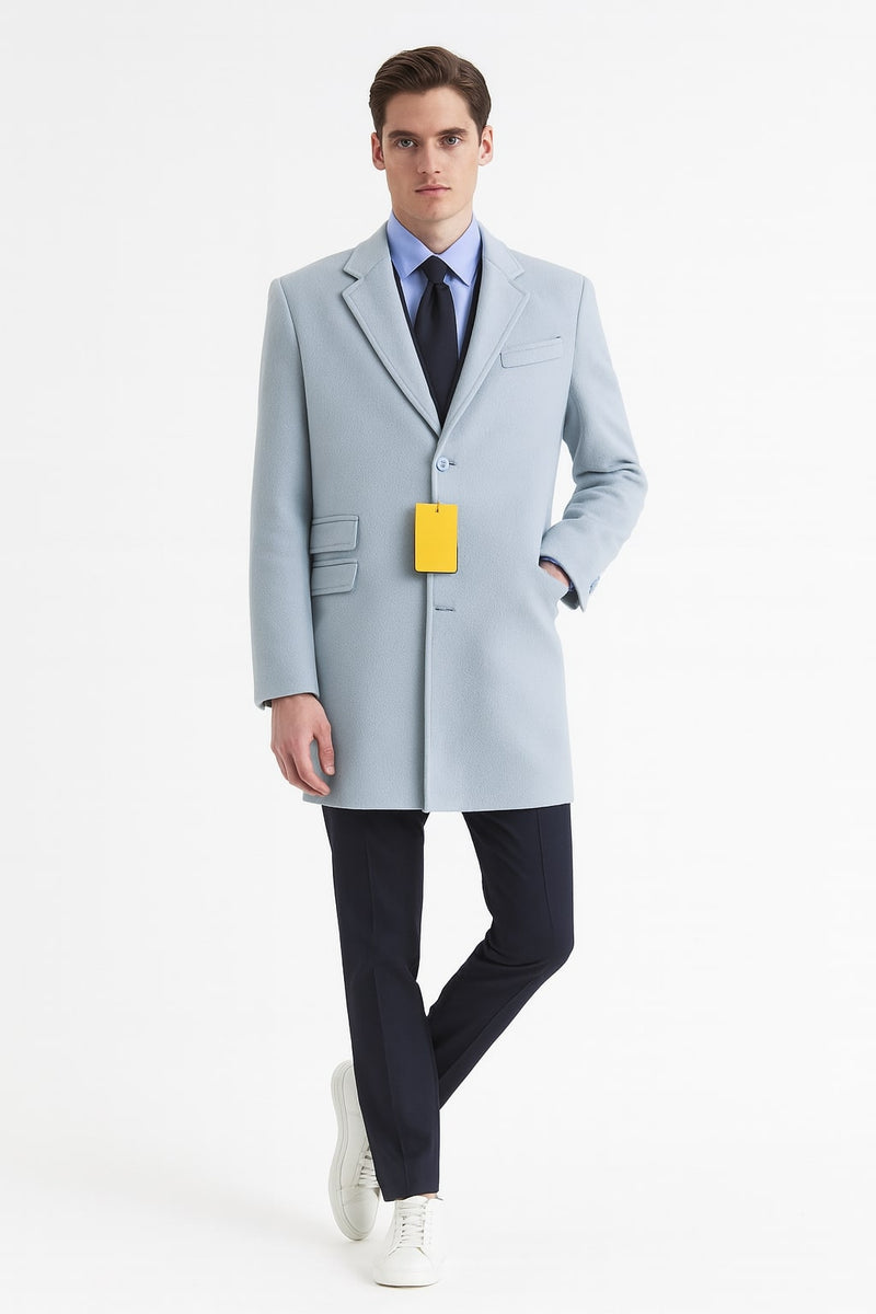 Light blue wool overcoat. Modern long design with tailored fit, single button, notched lapels, and side pockets. Textured fabric enhances the sleek sky blue color.
