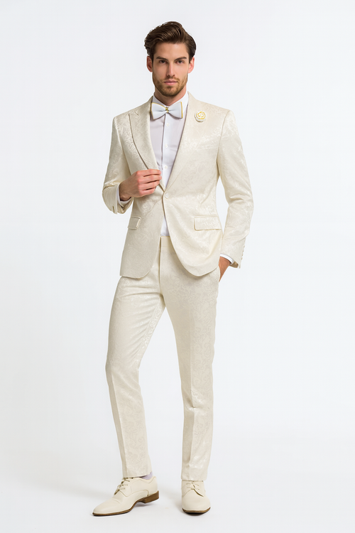 Men's champagne ivory tuxedo suit with paisley jacquard. Satin shawl lapel, fitted jacket with pockets, and slim-fit trousers. Subtle paisley pattern throughout.
