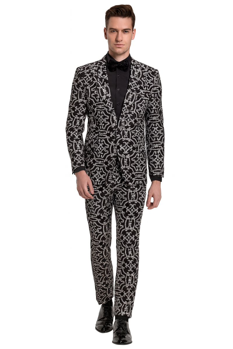 Men's black tuxedo with silver sequin pattern. Fitted silhouette, notched lapel, single-button jacket. Matching trousers complete the look.
