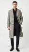 Alberto Nardoni men's grey herringbone overcoat: tailored silhouette, mid-length, structured shoulders, single-breasted. Features herringbone pattern, side pockets, back vent. Formal look, paired with dark trousers and boots.
