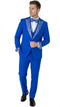 Royal blue tuxedo suit with white embellished lapel, matching bow tie, and sleeve details. Pleated blue trousers complete the structured, vibrant look.
