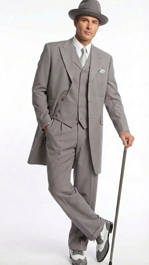 Men's gray zoot suit: long jacket, wide lapels, high-waisted trousers. Includes matching fedora. Styled with two-tone gray & white 1920s shoes.