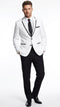 Men's white blazer with black trim, notched lapel, and a smooth finish. Single-breasted design. Paired with black trousers and a tie for a formal look. Lightweight material.
