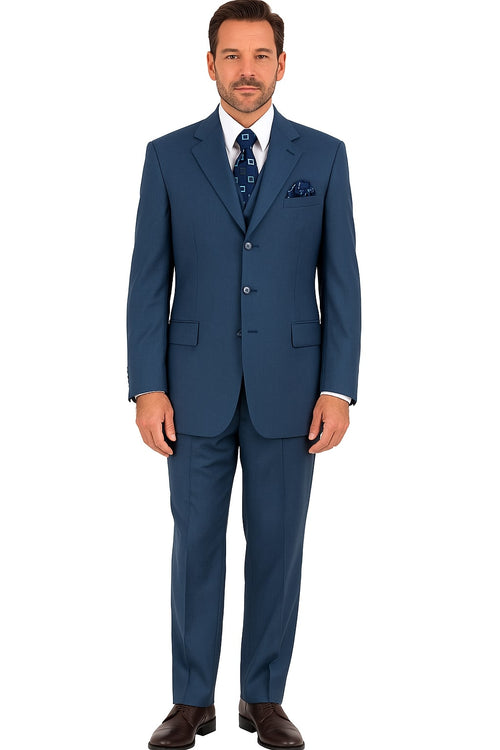 Men's steel blue classic suit. Fitted 3-button jacket with notched lapel and side pockets. Matching flat-front trousers with straight leg. Smooth fabric. White shirt and patterned tie add contrast.