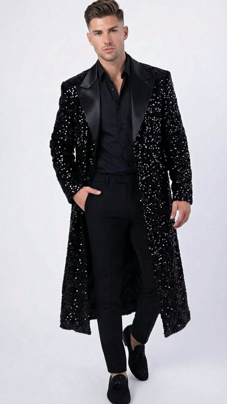 Men's black sequin long coat with satin shawl lapel, mid-calf length. Shiny black sequins create a reflective texture. Black lining completes the formal look.
