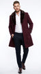 Men's burgundy three-quarter coat with faux fur collar. Fitted shape, side pockets, and structured design. Solid color, no patterns.
