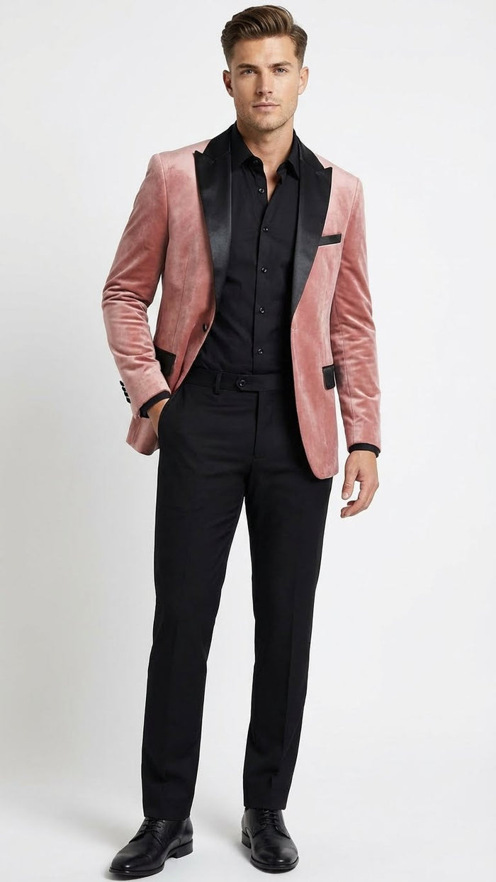 Men's dusty rose velvet blazer with black satin lapel. Fitted, single-button closure, two front pockets. Soft, textured fabric. Contrasting collar.
