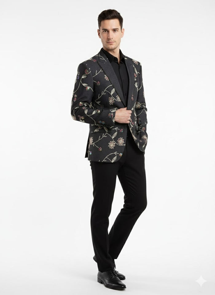 Black floral embroidered men's blazer. Fitted silhouette with vibrant floral designs on black fabric. Features notch lapel and two front pockets. Tailored for a luxury look.
