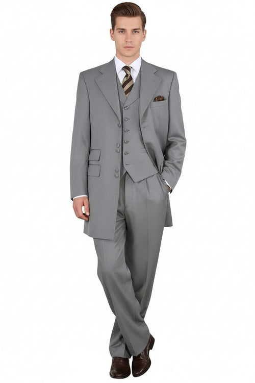 Light gray three-piece suit with vest, single-breasted jacket, and wide lapels. Subtle pinstripes. Vest: six buttons. Pants: relaxed fit. Smooth fabric.
