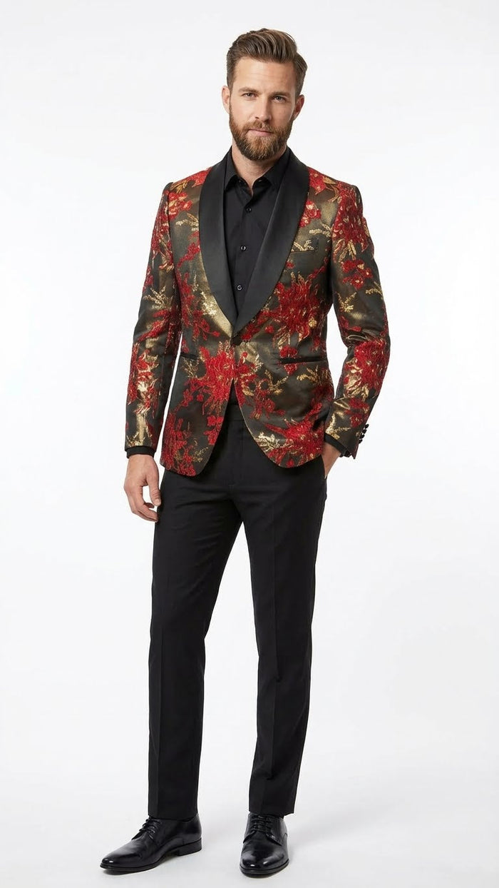 Men's red & gold paisley shawl lapel jacket: fitted silhouette, ornate floral design on smooth, shiny fabric. Rich red & gold against a dark backdrop. Paired with black trousers.
