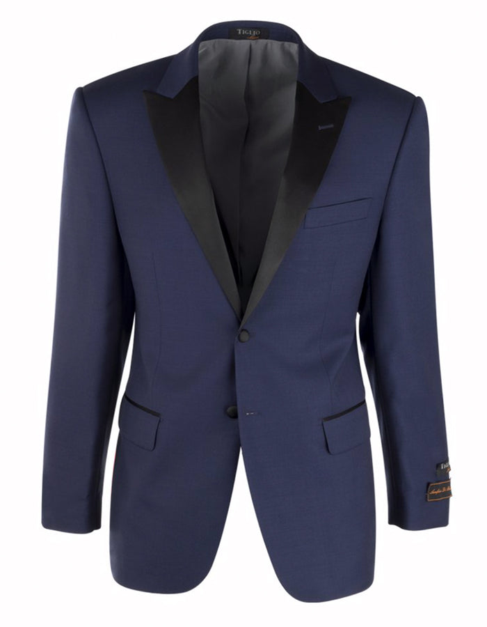 Navy blue peak lapel tuxedo inspired by The Great Gatsby. Single-button closure, two front pockets (one piped), and black inner lining for a sleek look.
