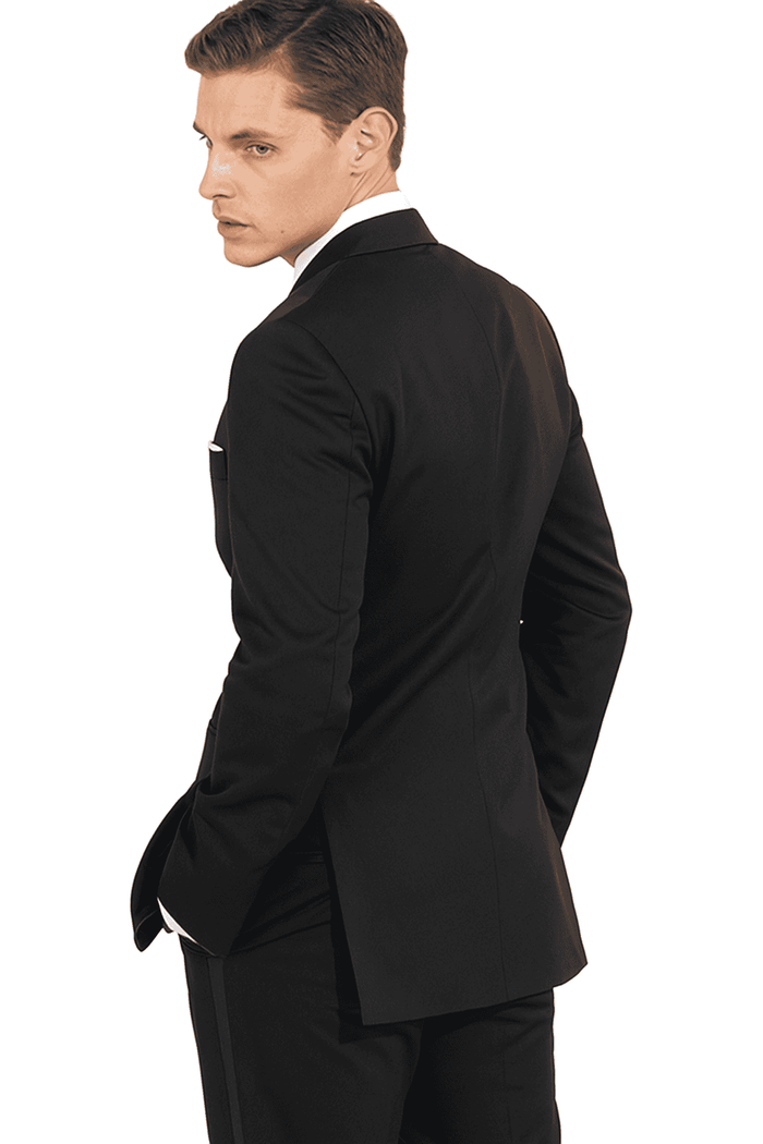 Mantoni black wool tuxedo. 2-piece, tailored silhouette. Features a 2-button jacket with sharp lapels & single back vent. Straight-cut trousers complete the dark, elegant aesthetic.