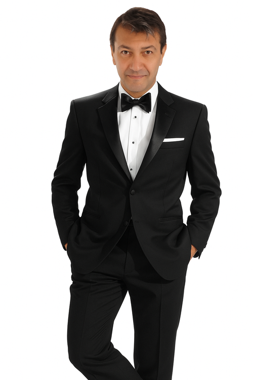 Mantoni 140s wool tuxedo: single-button, black, tailored fit. Satin peaked lapels. Wool fabric with smooth texture. Includes breasted pockets with white pocket square and matching pants.