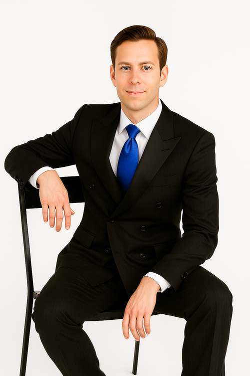 Giorgio Fiorelli double-breasted black stripe suit. Tailored, structured silhouette. Black with subtle pinstripes. Smooth, woven fabric. Wide lapels, double-breasted buttons, two pockets. Paired with white shirt and blue tie.
