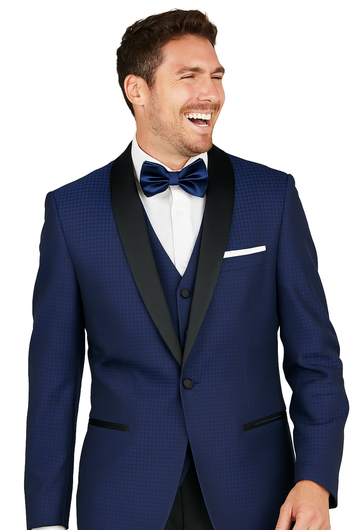 Arlan French blue tuxedo: one-button closure, black satin lapel, textured deep blue fabric. Includes two front pockets, white pocket square, and matching vest.
