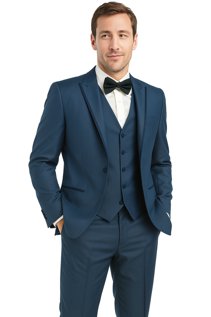 Blue sharkskin tuxedo: single-breasted jacket with peak lapels, slim-fit trousers. Features a finely textured surface and smooth finish. Includes satin bow tie and white dress shirt. Tailored for a structured look.
