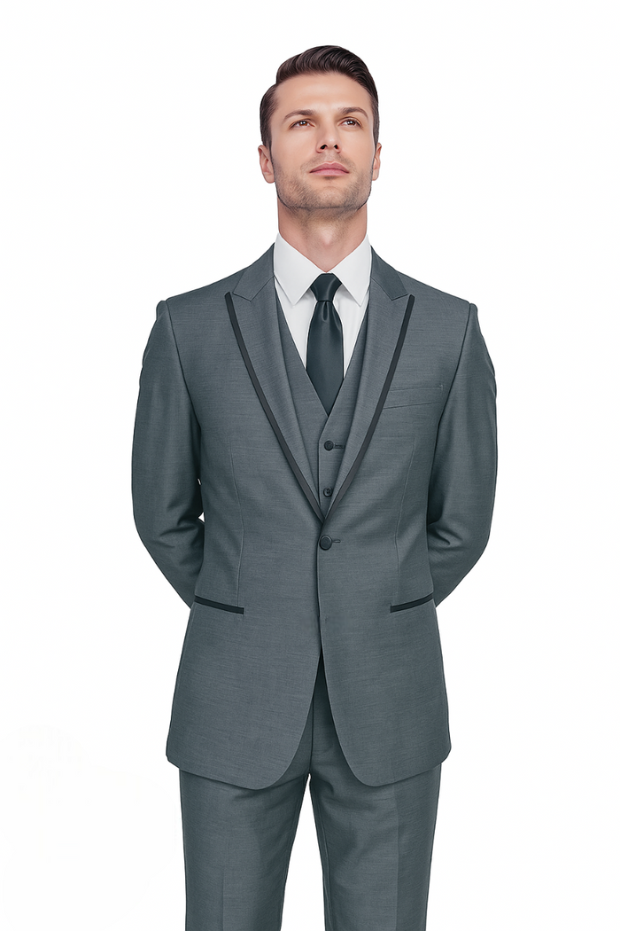 Gray sharkskin tuxedo suit with tailored fit. Single-breasted jacket with black-outlined lapels, matching vest, and straight-leg trousers. Smooth, subtly sheened fabric.
