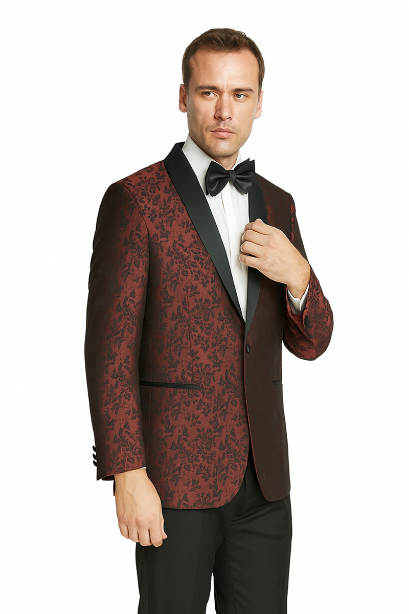 Giorgio Fiorelli's jacquard tuxedo: burgundy/gray floral, black satin shawl collar, single-button closure. Tailored fit, long sleeves, side pockets. Paired with black trousers for a formal look.
