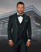 Hunter green men's tuxedo with satin trim, shawl lapel, and a fitted vest. Includes a three-button vest closure and shawl collar. A stylish formalwear option.
