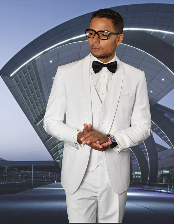 Men's white tuxedo with shawl lapel and satin trim. Includes jacket with long sleeves, matching vest, and trousers. Fitted, elegant design.
