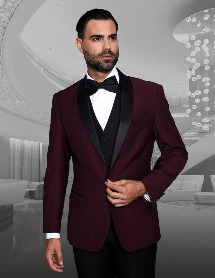 Burgundy wool tuxedo with shawl lapels, single-button closure, and matching vest. Features black accents, a smooth finish, and sleek fit.

