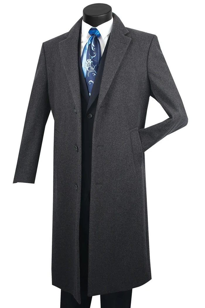 Men's charcoal grey wool-cashmere overcoat. Full-length, straight silhouette with notched collar and three buttons. Smooth wool-cashmere blend. Side pockets. Classic, pattern-free dark grey.
