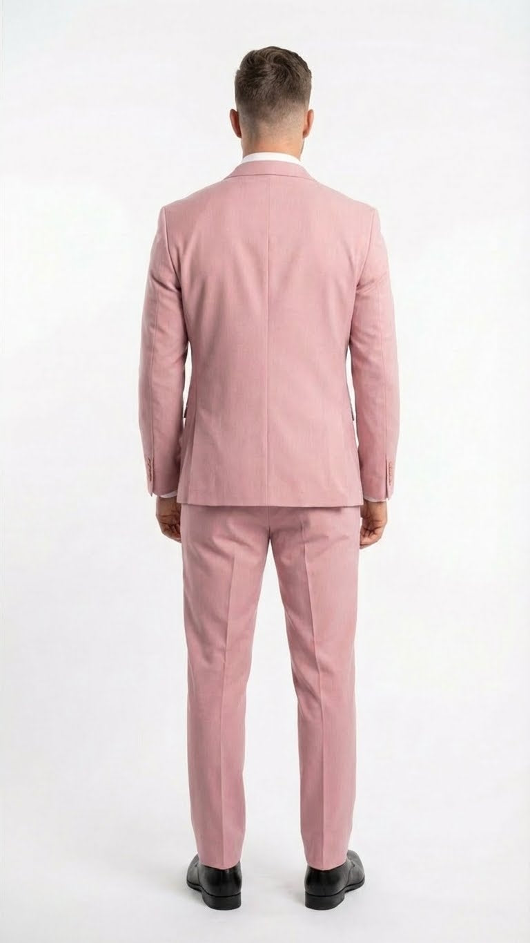 The vitali brand modern fit men’s light pink formal suit features a fitted blazer and trousers in a blush color, made from a smooth fabric. The suit includes a single vent at the back and subtle stitching details.
