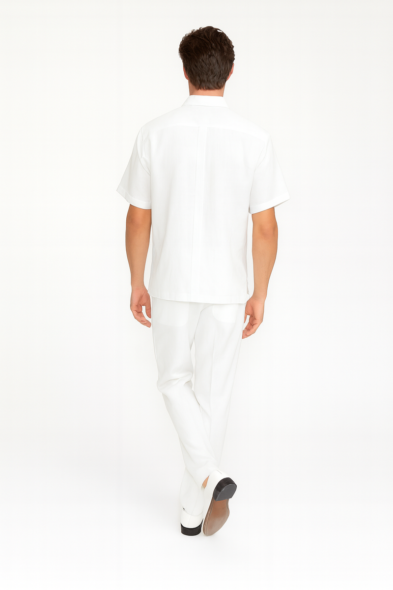 Men's white linen guayabera set: short-sleeve embroidered shirt & slim-fit pants. Shirt features front embroidery & back pleat. Perfect for warm weather.
