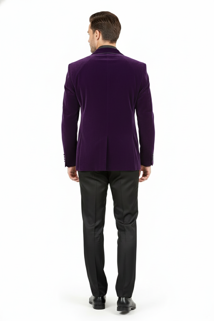 Men's purple velvet blazer with tailored fit, single back vent, and structured shoulders. Shown from the back with black trousers and shoes.
