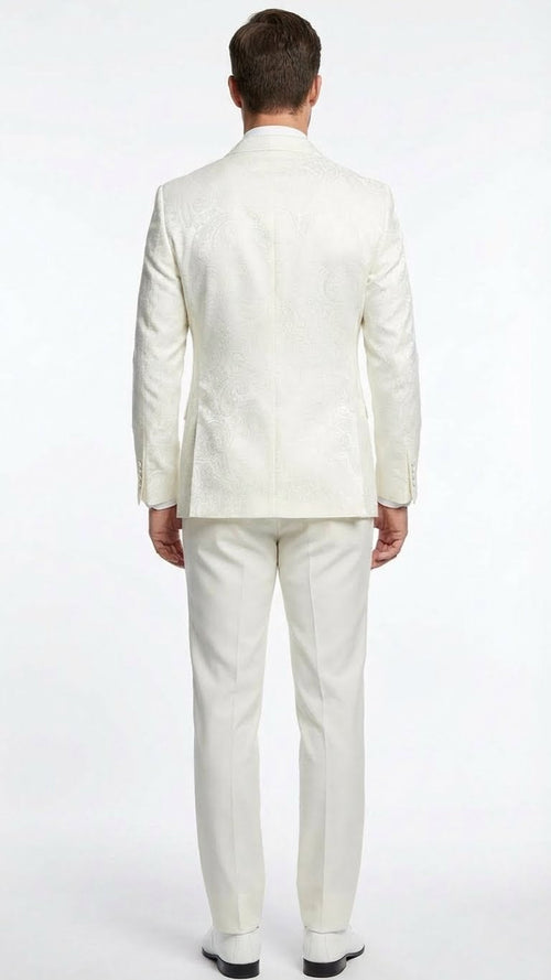 Ivory double-breasted tuxedo. Textured jacket with intricate pattern, structured shoulders, and tail hem. Paired with matching straight-leg trousers, fitted silhouette. Predominantly ivory.
